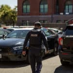 Alameda Post - An officer walks to his car at the Alameda Police Department in Alameda on Aug. 28, 2023. Photo Semantha Norris, Calmatters.