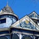 Alameda Post - a beautiful blue Queen Anne style home with a turret and lots of decorative features.