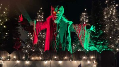 Alameda Post - A Krampus decoration looming over a fence.