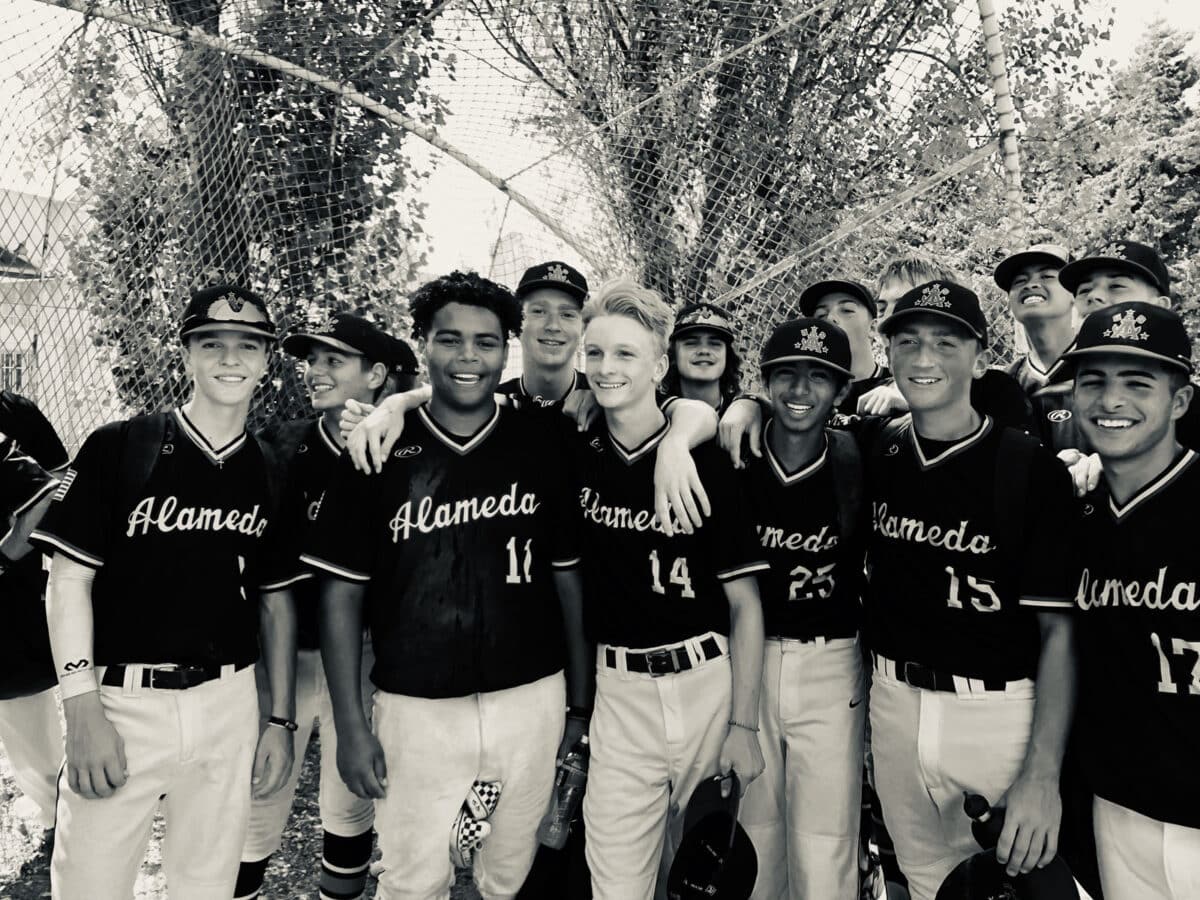 Alameda Post - a black and white group photo of young baseball players in uniforms that say Alameda