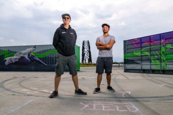 Alameda Post - Pancho Pescador (left) and Pablo Raiz Arroyo (right) painted “Life of Flight”, a set of murals on shipping containers at Alameda Point’s taxiway along Seaplane Lagoon. Photo Maurice Ramirez.
