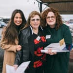 Alameda Post - Joanne Guitarte and Madlen Saddik with 2024 President’s Award winner, Becca Perata, were undeterred by the weather. Photo © Maurice Ramirez