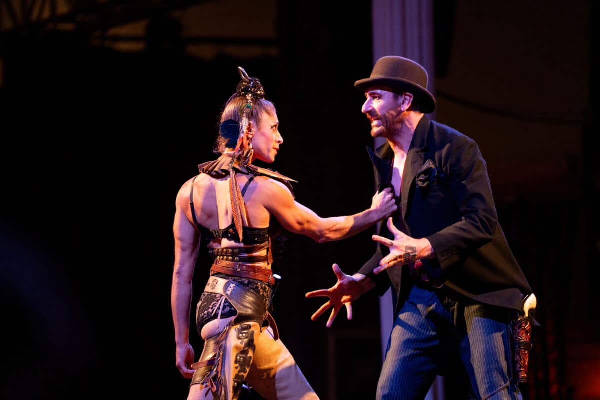 Alameda Post - a woman grabs a man's vest onstage