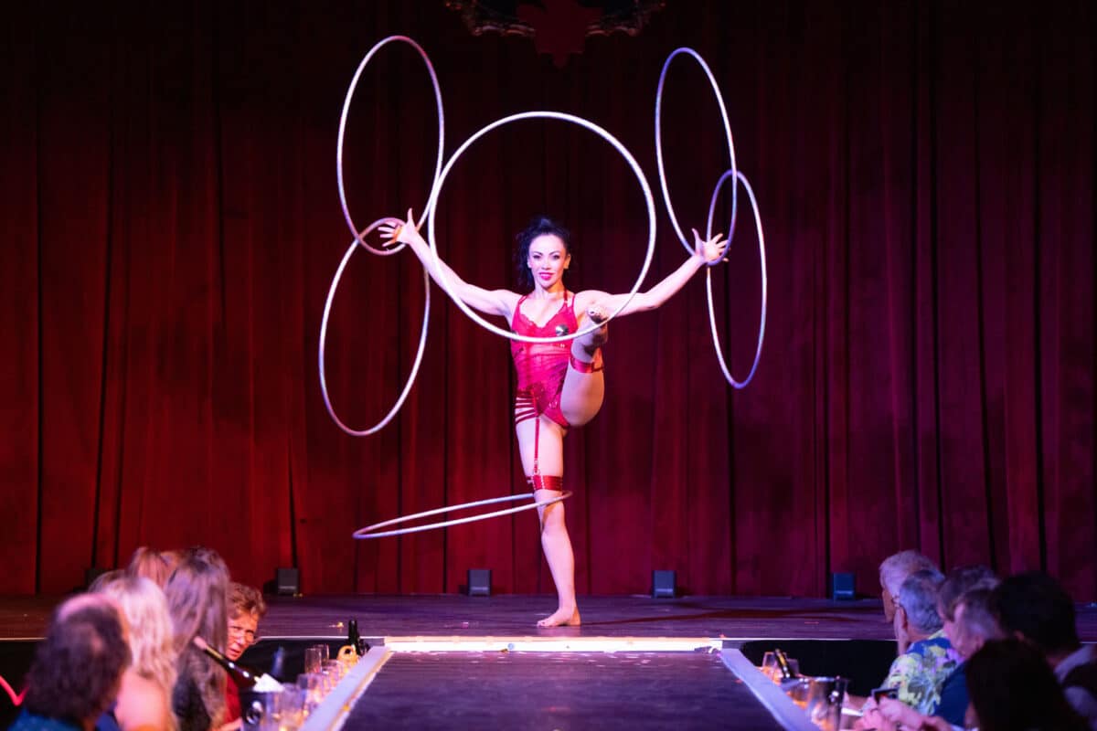 Alameda Post - a performer twirls 6 hoops on her body
