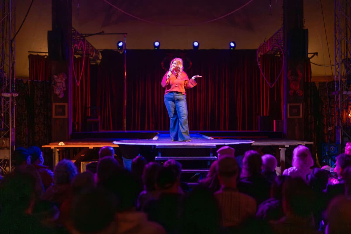 Alameda Post - A woman speaks into a microphone at Spooky Tales.