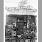 Alameda Post - a black and white photo of an old hardware store and a horse and carriage outside