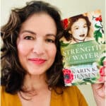 Alameda Post - Author Karin K. Jensen holds the second edition of The Strength of Water.