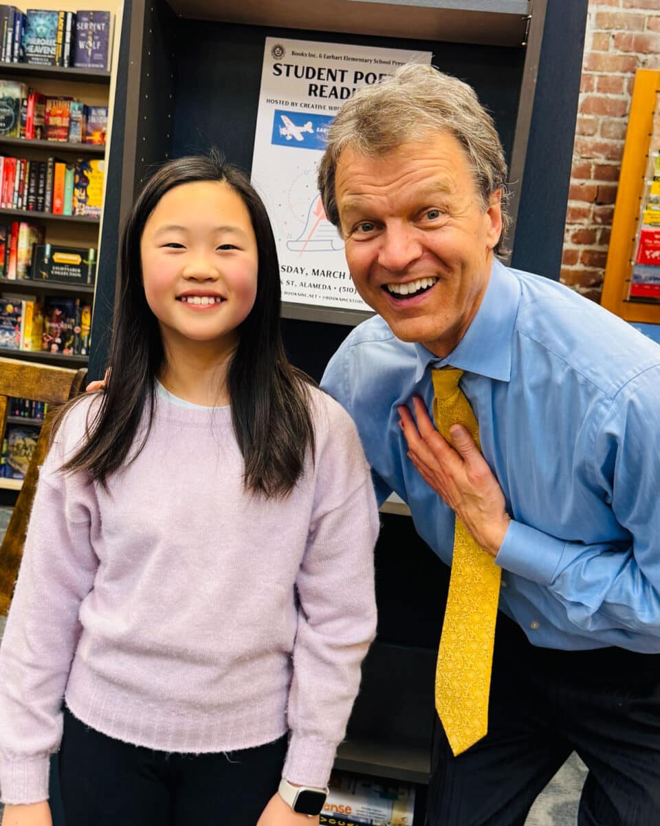 Alameda Post - Will Green smiles with a student