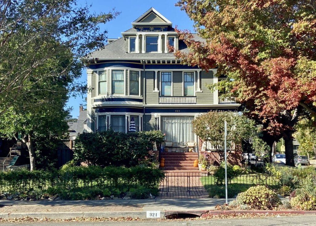 Alameda Post - 921 Grand Street, a handsome three story home with a brick walkway and stairs