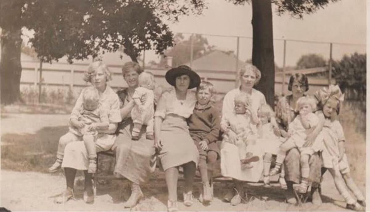 Alameda Post - a sepia photo of a family gathered together at Lincoln Park