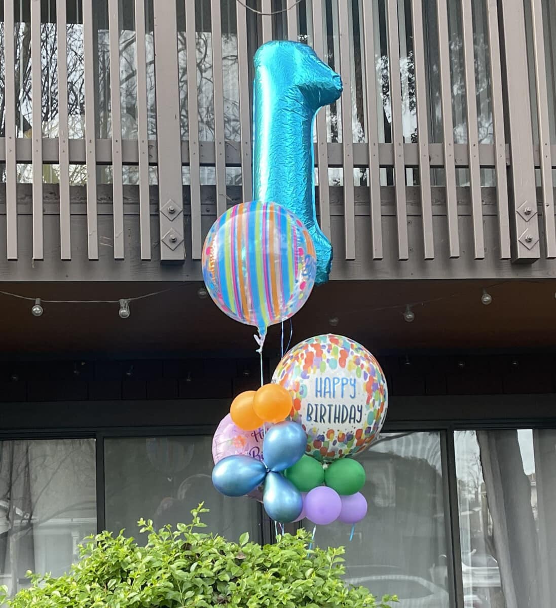 Alameda Post - A bouquet of birthday balloons with a large number 1. 