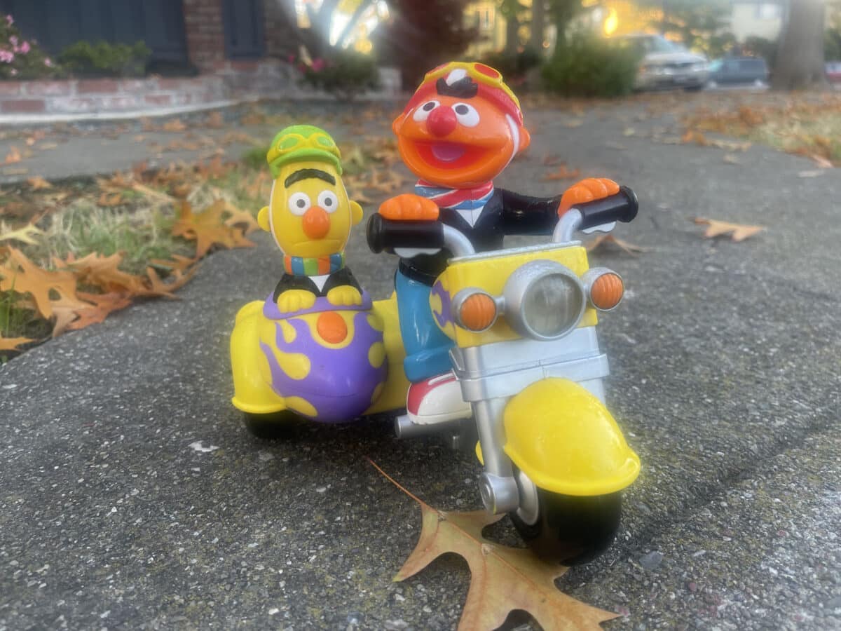 Alameda Post -A plastic toy of Bert and Ernie on a motorbike with a sidecar.