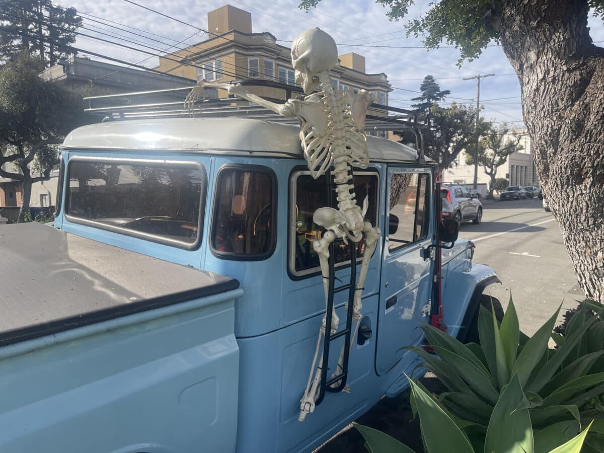Alameda Post - A skeleton decoration hanging on a pickup truck. 