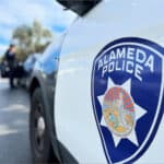 Alameda Post - a photo of a badge on an Alameda Police vehicle