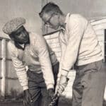 Alameda Post - Bateman teaching a student holding a golf club