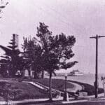 Alameda Post - a photo of a few buildings looking over into the ocean, prior to their demolition by Utah Construction