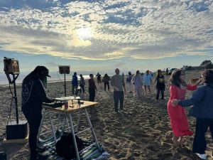 Alameda Post - People dance on Alameda's beach.