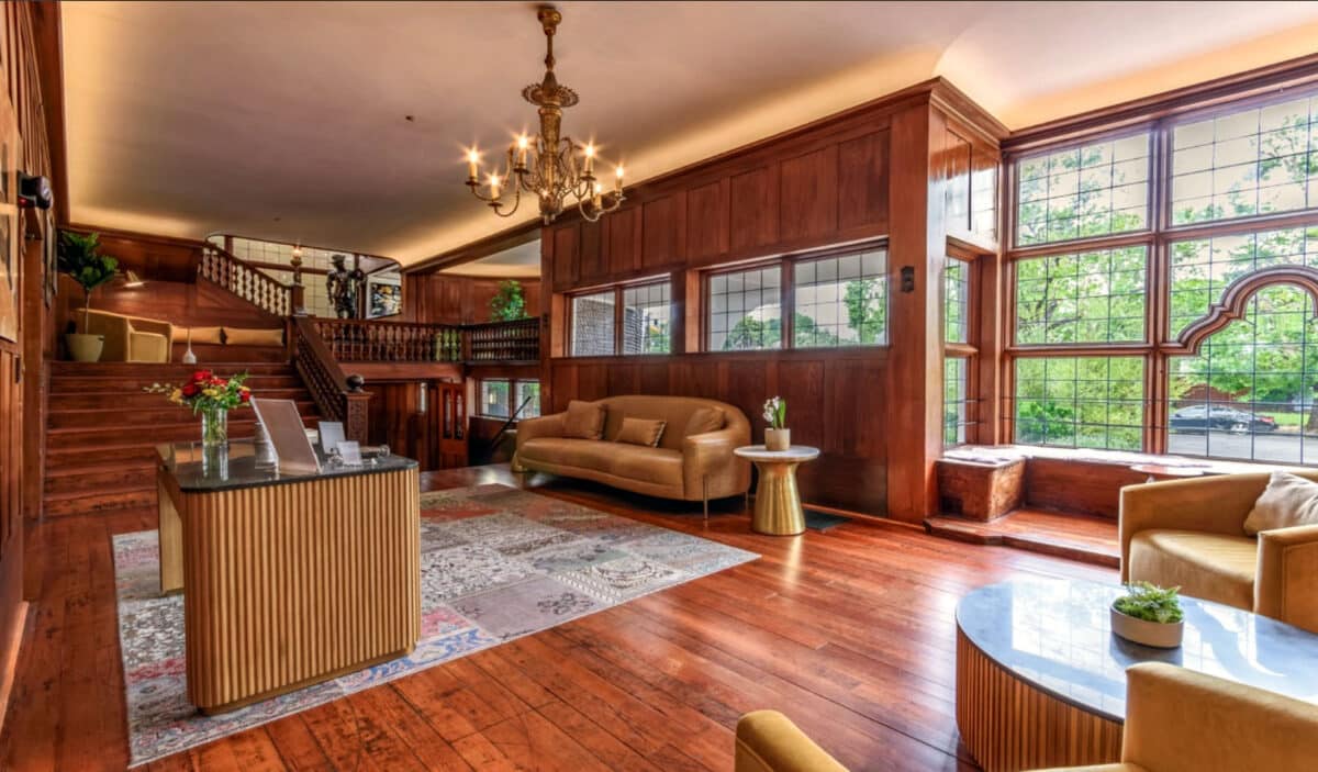 Alameda Post - A beautifully decorated large room and staircases at Cedar Gables. 