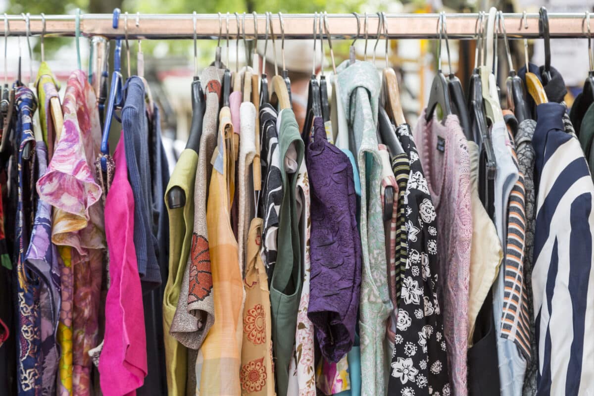 Alameda Post - A rack of second hand clothes. 