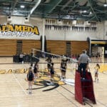 Alameda Post - In the Alameda High School gym, the AHS and SJND volleyball teams play a match.