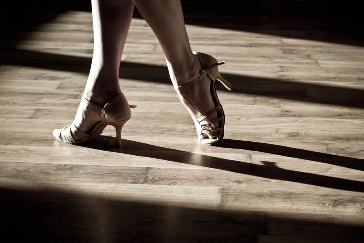 Alameda Post - A person wearing a pair of ballroom shoes on a hardwood floor. 