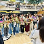 Alameda Post - dancers in their street clothes greet attendees, hold flowers, and smile through tears