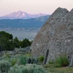 Alameda Post - a set of huge ovens built out of stone and Wheeler Peak in the distance