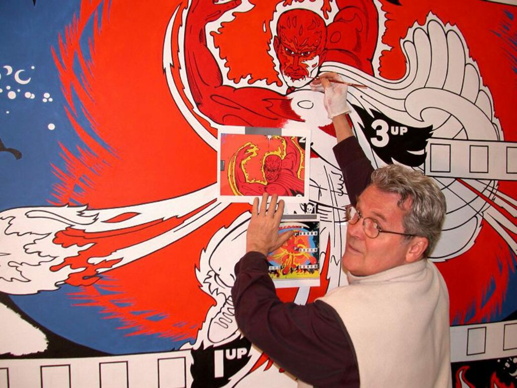 Alameda Post - Ed Cassel looks over his shoulder while painting a mural
