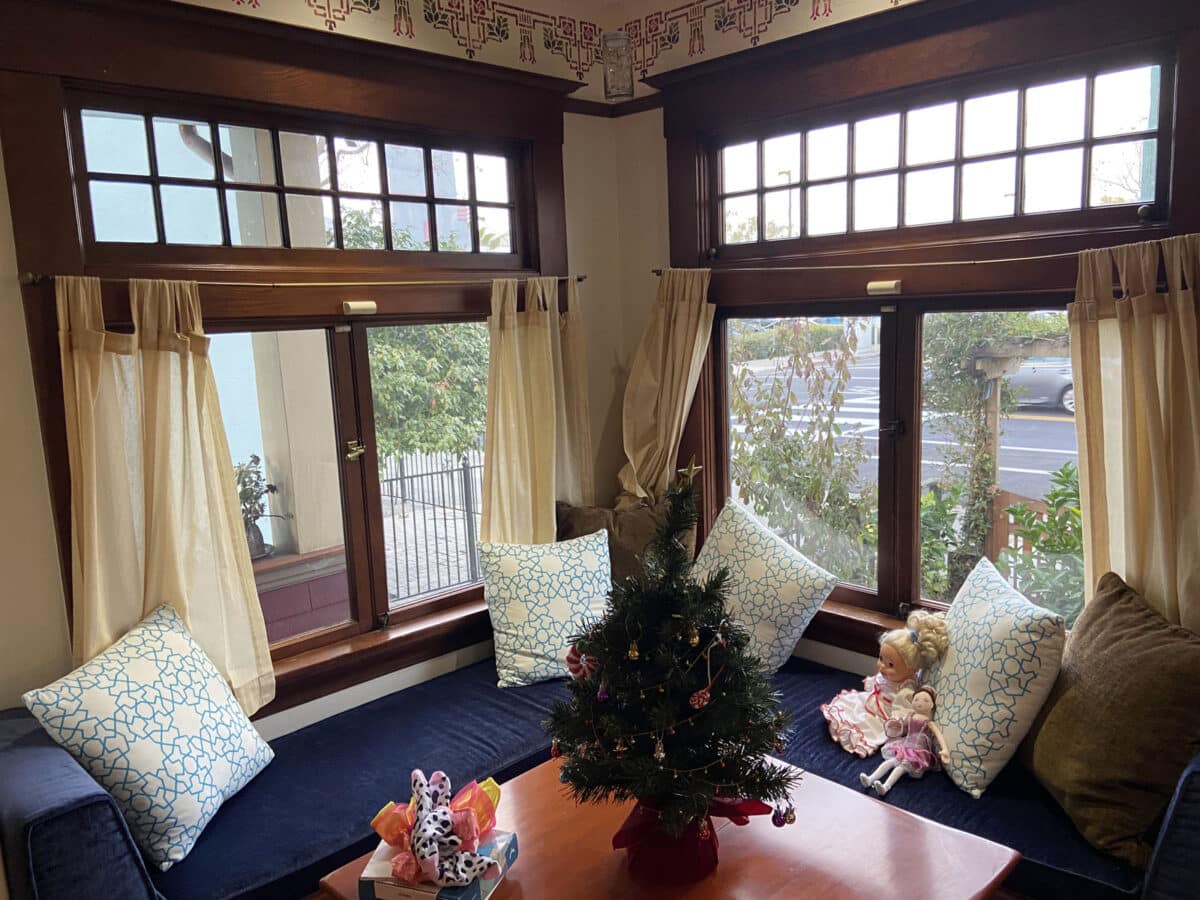 Alameda Post - a cozy, built in bench and seating area by the front windows of a home