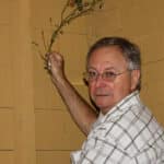Alameda Post - George Gunn holds a portion of a plant