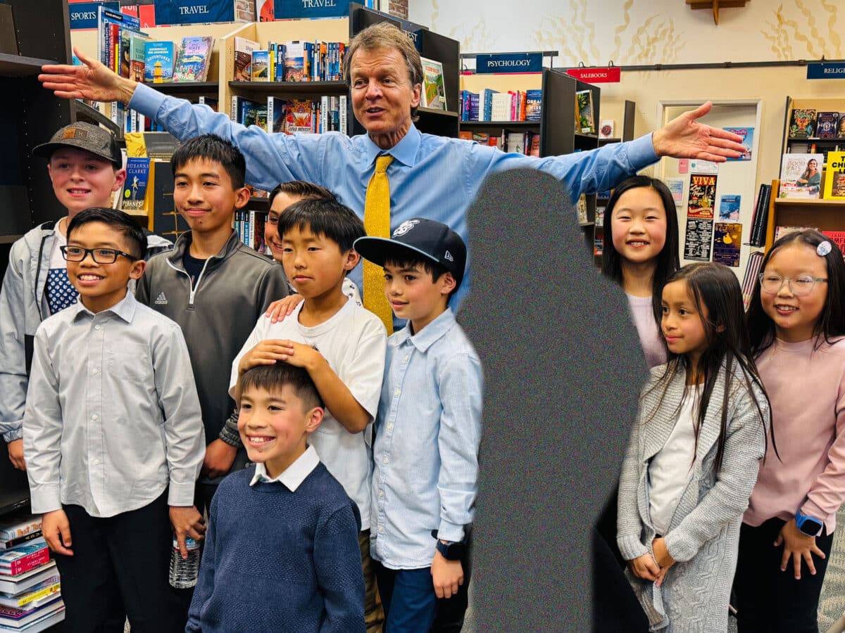 Alameda Post - Will Green stands with a group of children at Books Inc