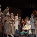 Alameda Post - a large cast onstage in peasant clothes and period attire