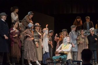 Alameda Post - a large cast onstage in peasant clothes and period attire