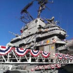 Alameda Post - the USS Hornet decorated in flags