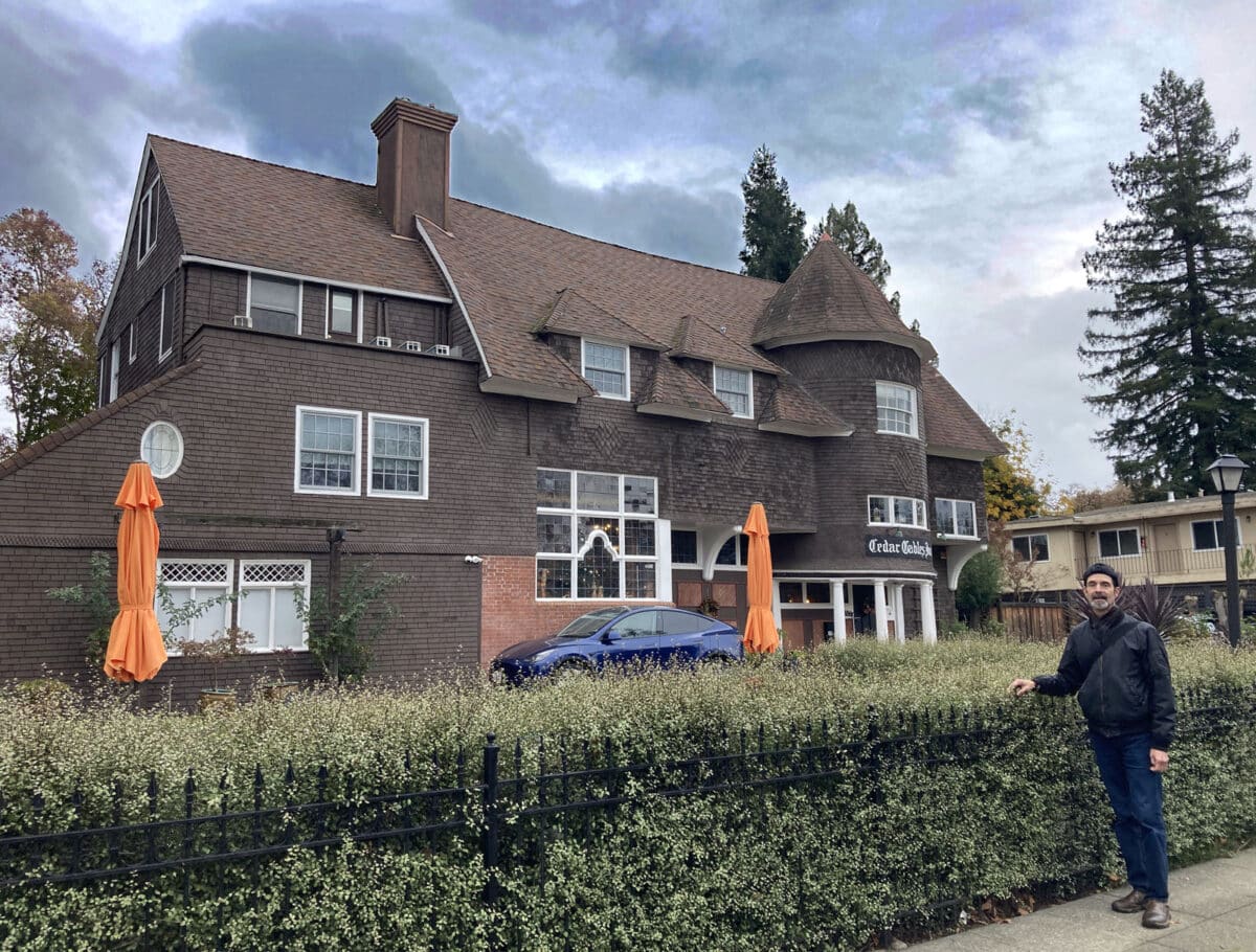 Alameda Post - A man stands in front of Cedar Gables Inn