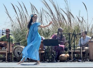 Alameda Post - a dancer in a blue dress performs in the Rising Seas event on July 12, 2025