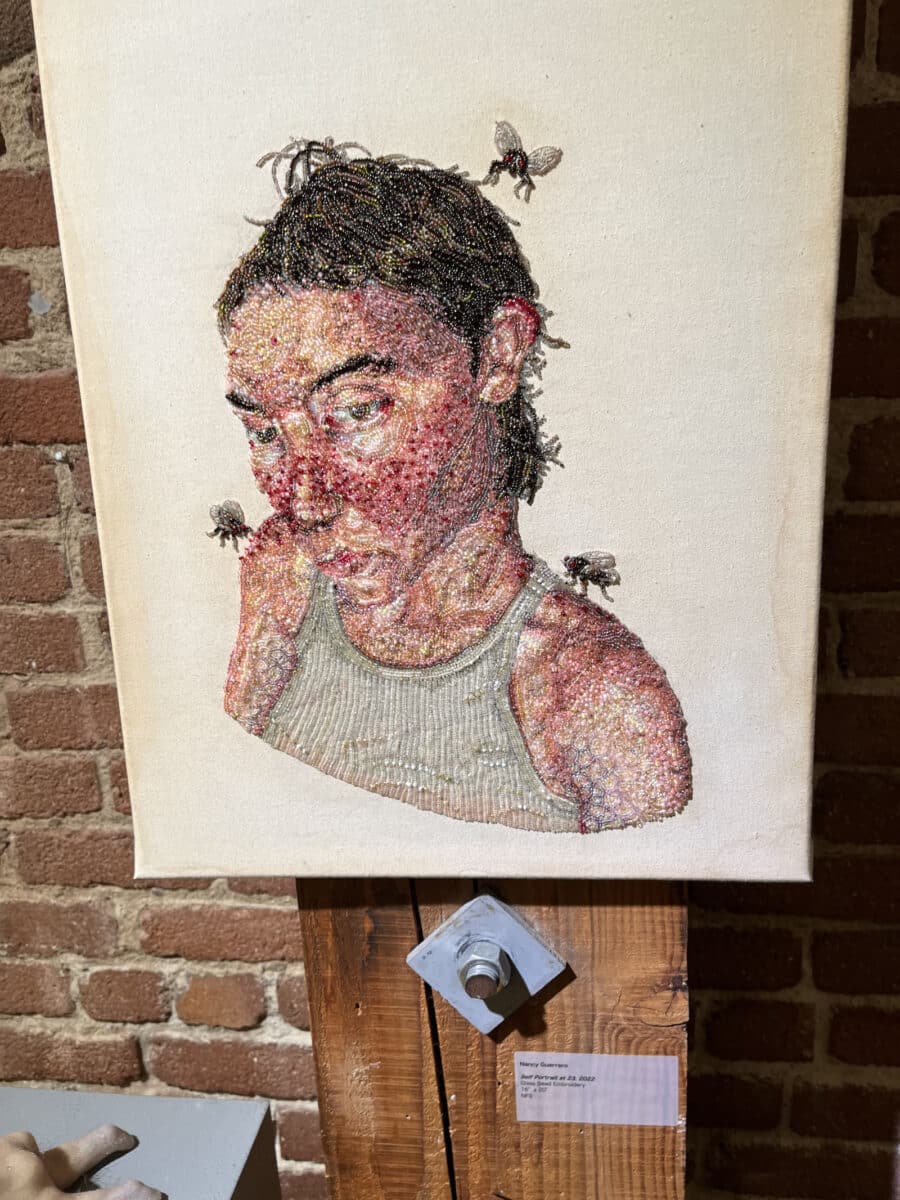 Alameda Post - A striking piece of art depicting a person in a white tank top with acne and flies buzzing around them.