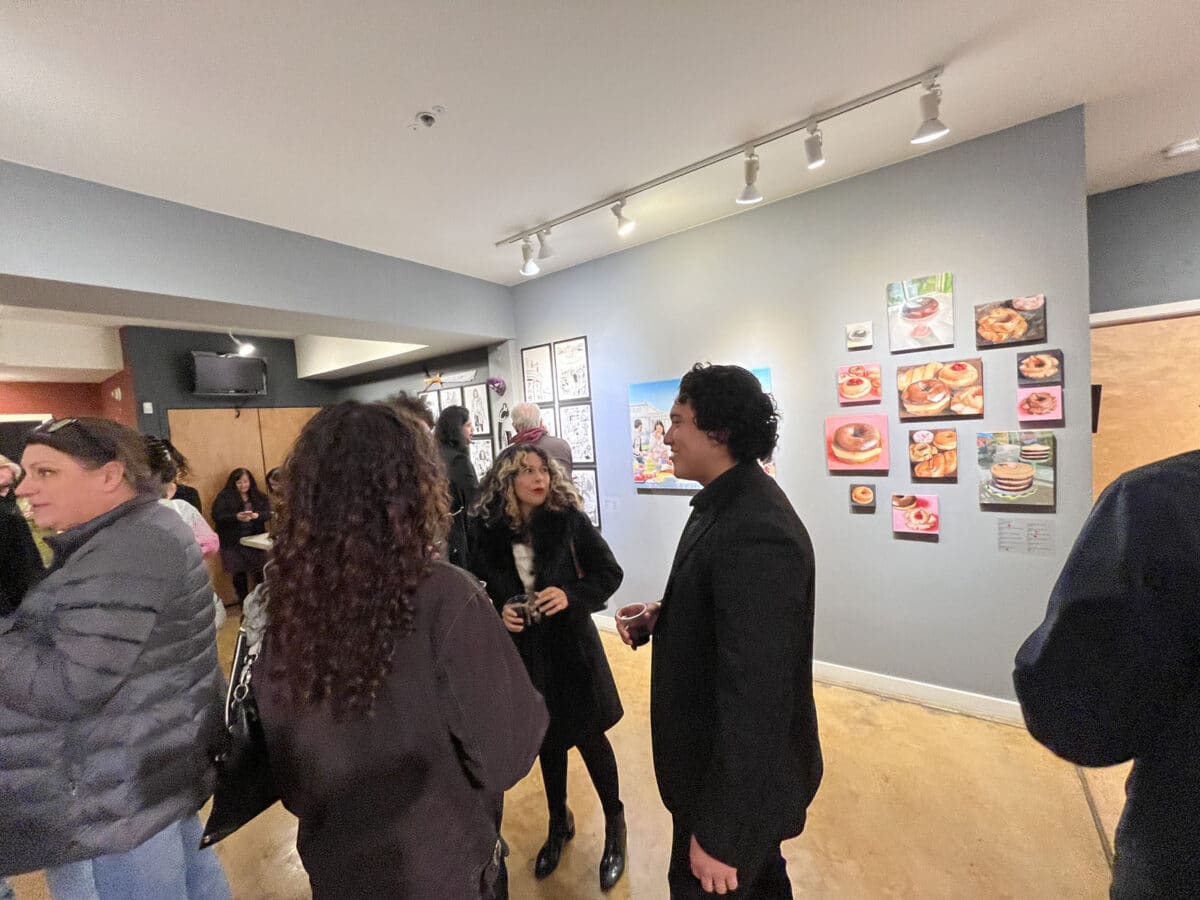 Alameda Post - Visitors at the Art Comes from Art, Comes from Art gallery chat and drink wine.