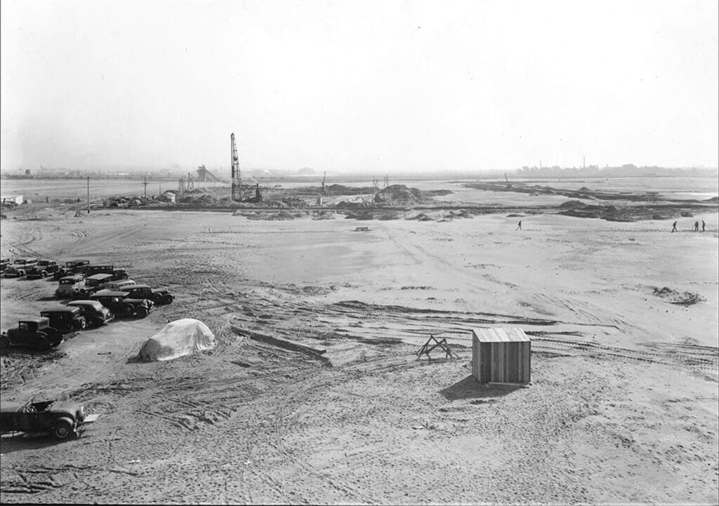 Alameda Post - a black and white photo of a construction site of the Alameda Naval Air Station