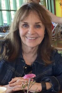 Alameda Post -Nancy Seamons Crookston smiles at the camera