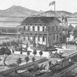 Alameda Post - a black and white drawing of Alameda Salt Water Baths or The Newport Baths. Carriages pull up to a large structure next to the water. In a corralled area, people swim in the ocean. A railroad train drives by