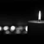 Alameda Post - a black and white photo of a lit candle