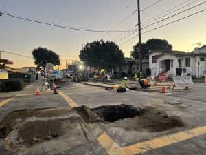Alameda Post - A large hole in the road, lots of construction workers, and heavy machinery at the sight of a gas leak.