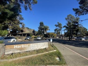 Alameda Post - The parking lot, sign, and front of the building at Harbor Bay Club.