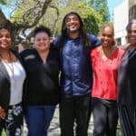 Alameda Post - five people of color who comprise the AUSD Office of Equity stand together and smile at the camera