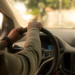 Alameda Post - a driver in a car