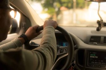 Alameda Post - a driver in a car