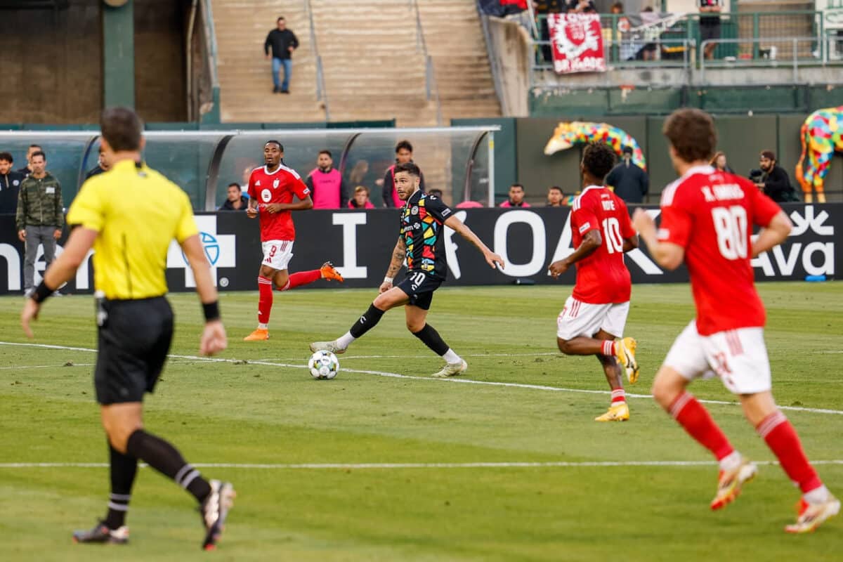 Alameda Post -an Oakland Roots player dribbles the ball in a match against Phoenix Rising FC