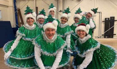 Alameda Post - About eight new saplings smile in their Christmas tree costumes.