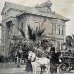 Alameda Post - a black and white photo of a horse drawn vehicle parked in front of a large mansion.
